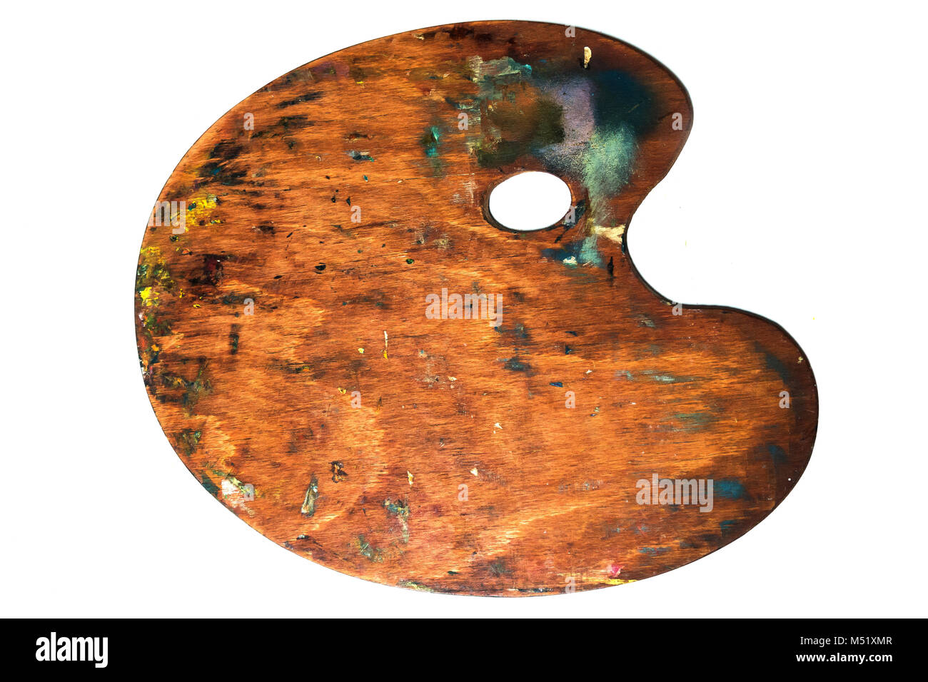 Real art wooden palette with blobs of paint and a brush on white background. Concept Art and Craft Stock Photo