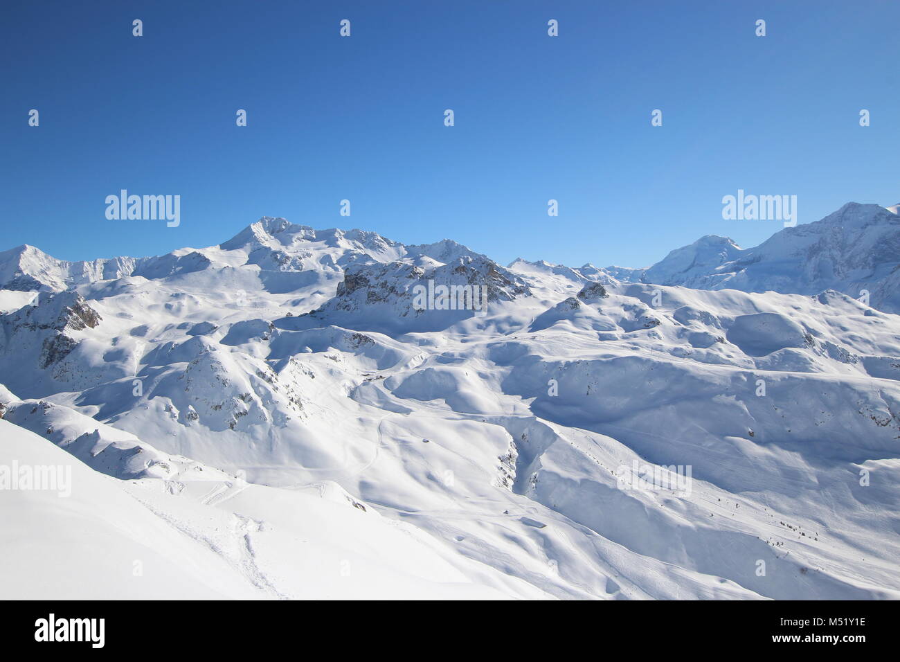 Panoramic view of idyllic summer landscape in the Alps with clear mountains, glacier and blue skyin the background Stock Photo