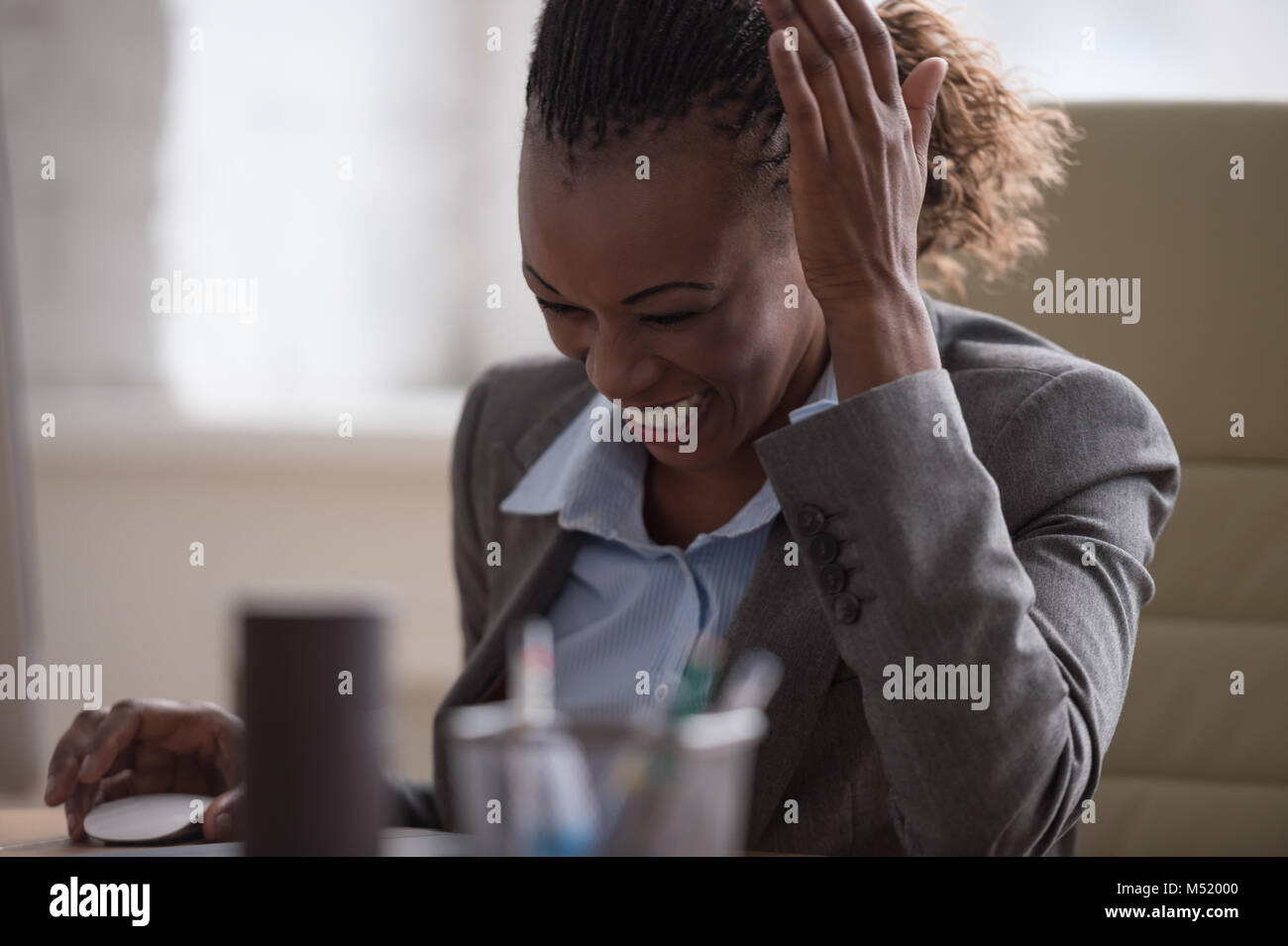 African pretty business woman working at pc in office Stock Photo - Alamy