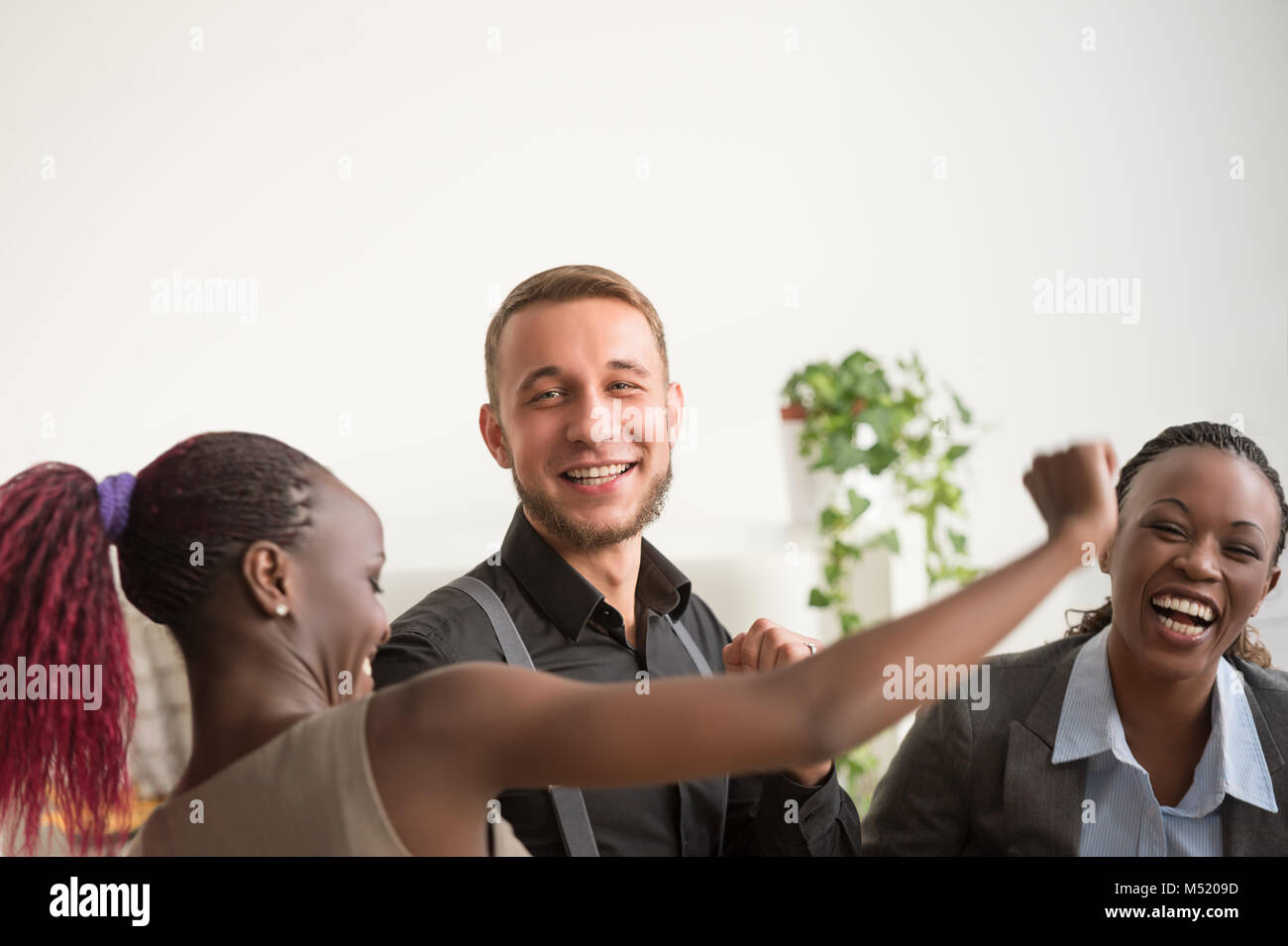 Business team celebrating a good job in the office Stock Photo - Alamy