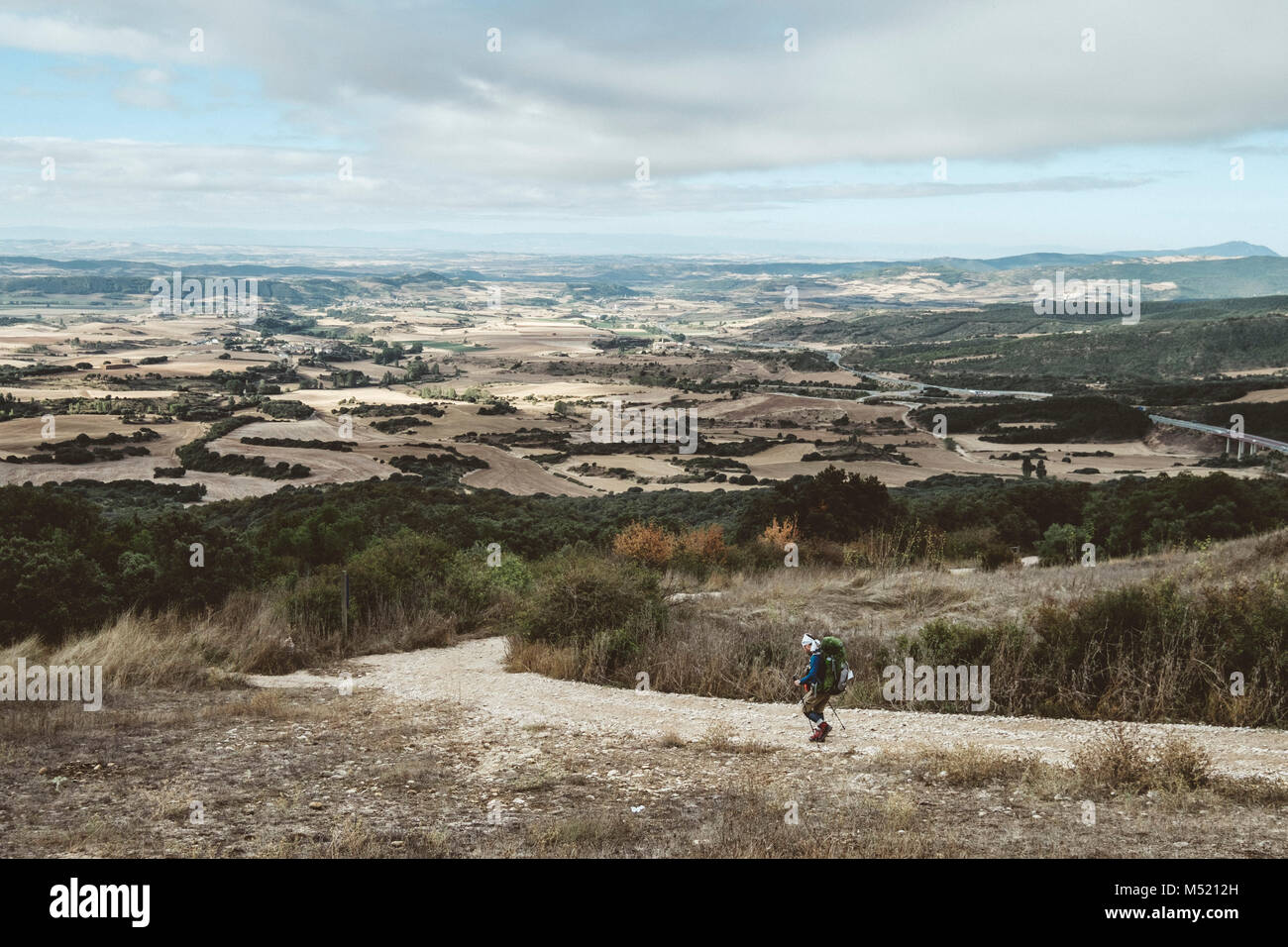 Hiker walking down footpath, Pamplona, Navarre, Spain Stock Photo Alamy