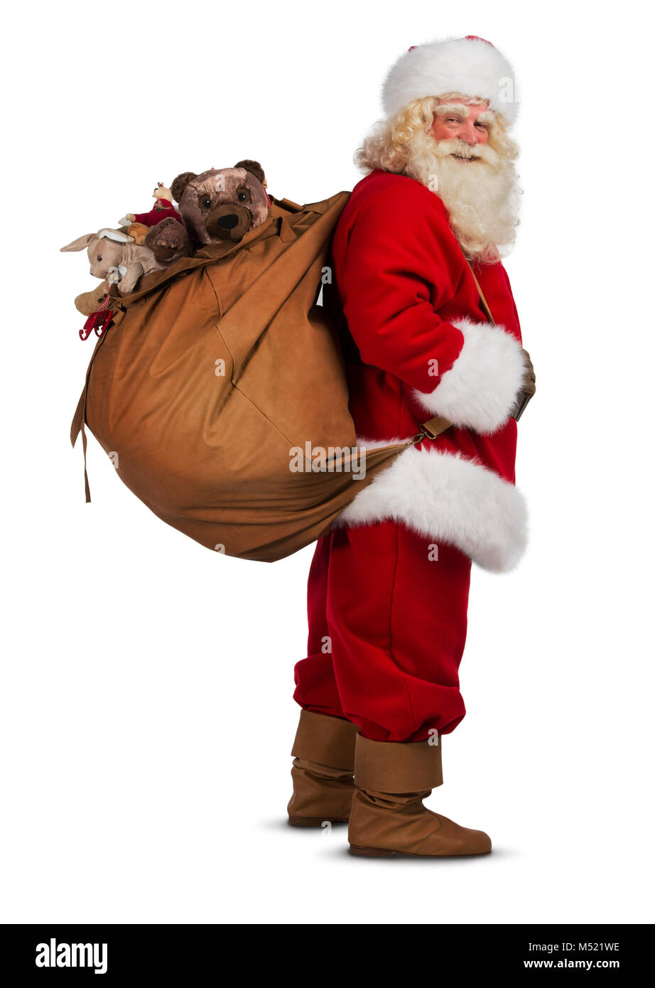 Real Santa Claus carrying big bag full of gifts, isolated on white ...
