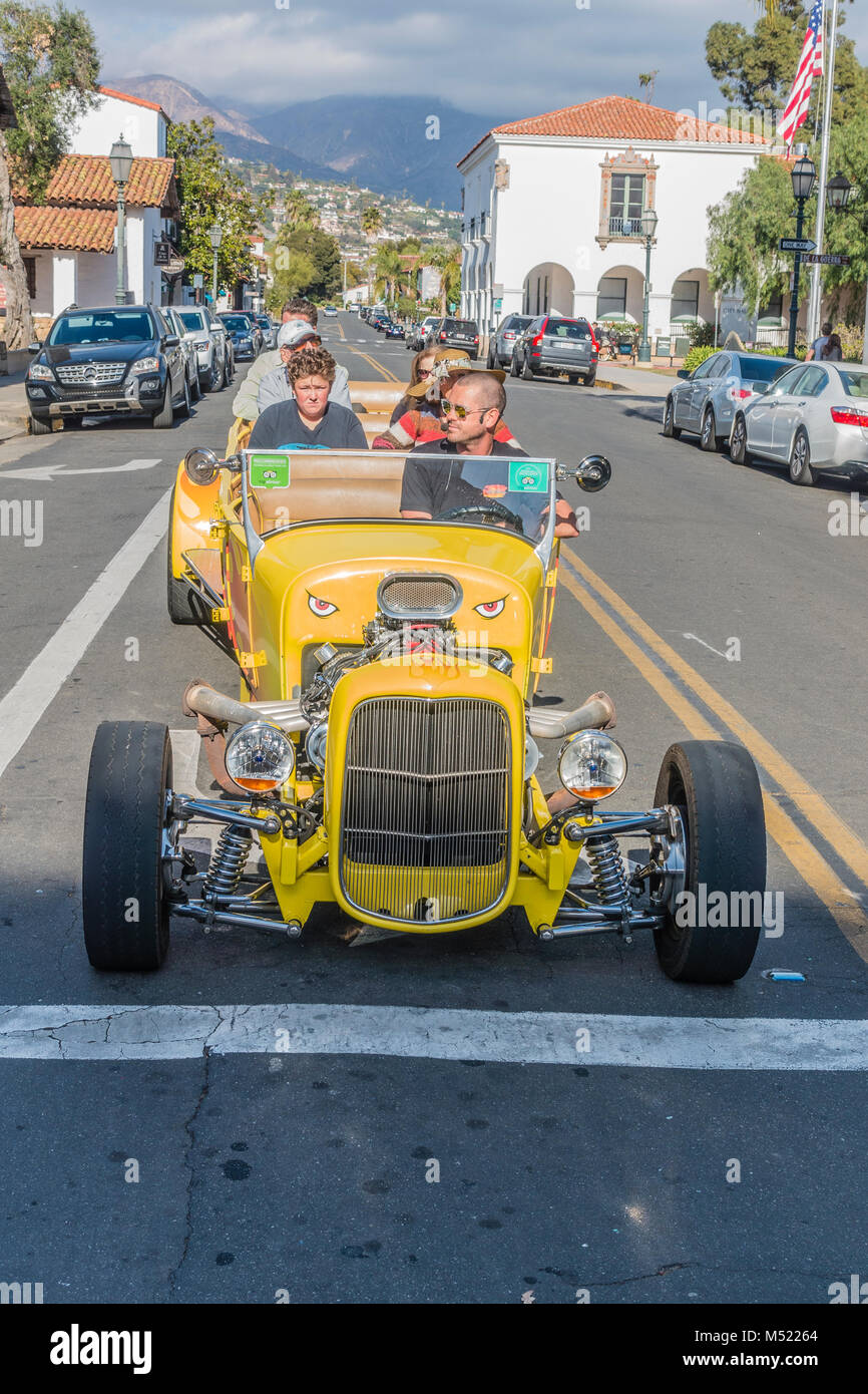 A yellow convertible hot rod limousine drives paying tourists around Santa  Barbara Stock Photo - Alamy