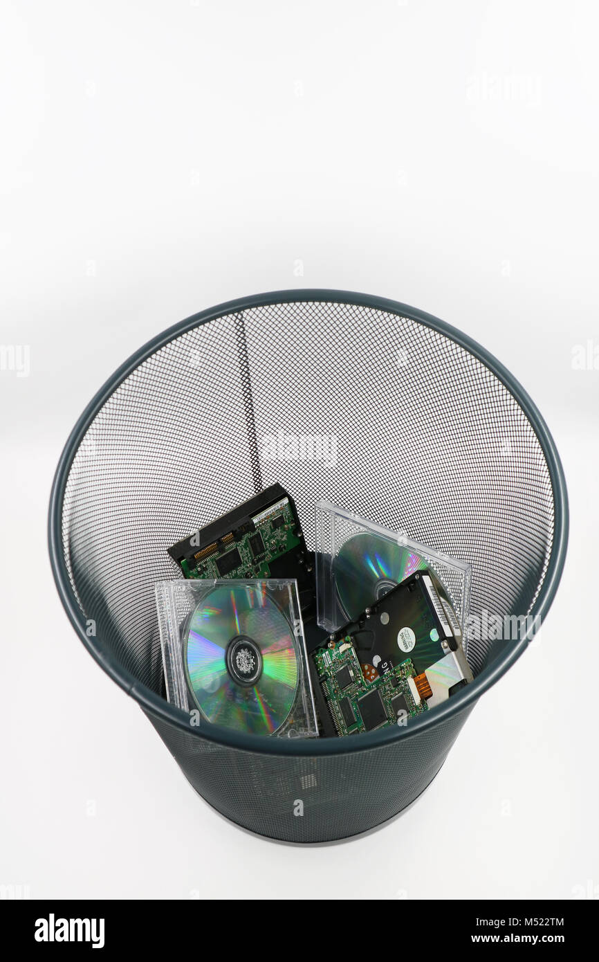 A waste basket of used disks and cds Stock Photo