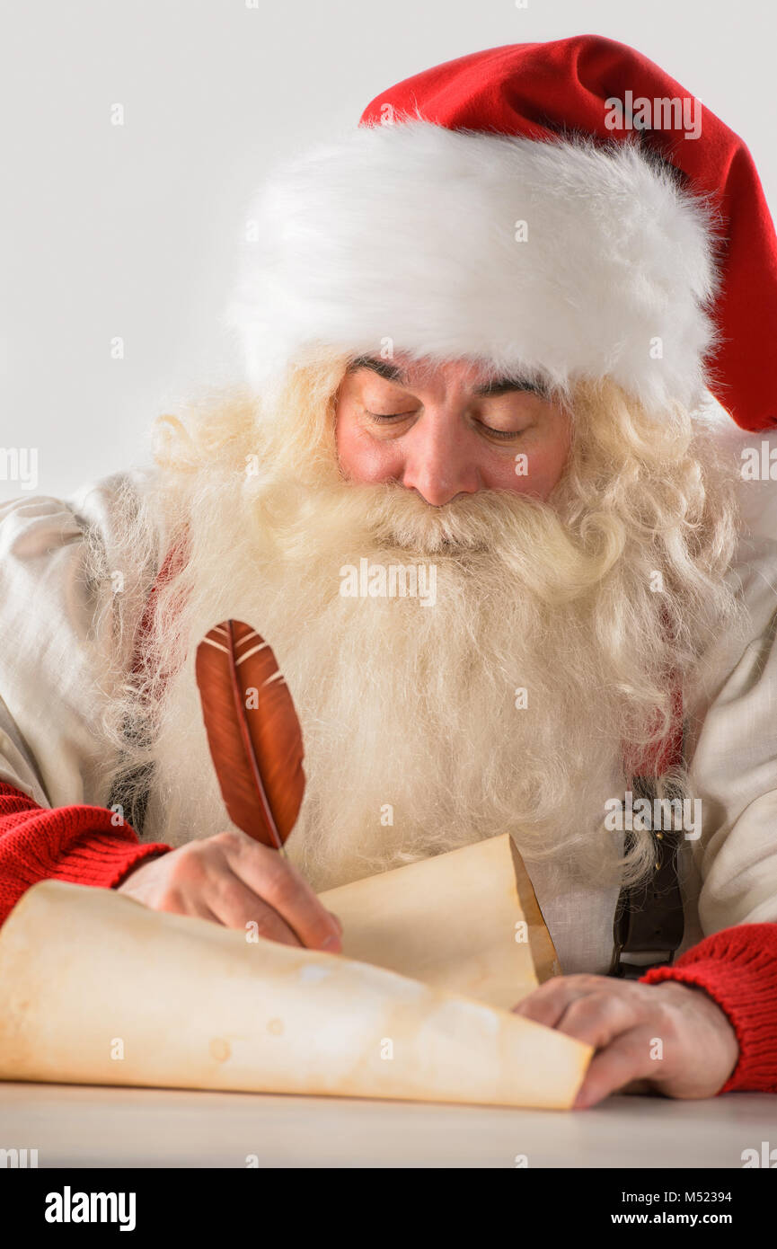 Real Santa Claus writing list of gifts or responding to children's