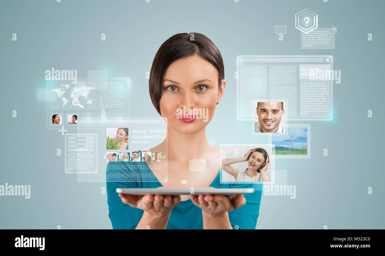 Young pretty woman using social media on her tablet computer Stock Photo