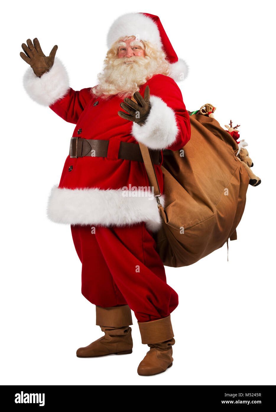 Full length portrait of Real Santa Claus carrying big bag full of gifts ...