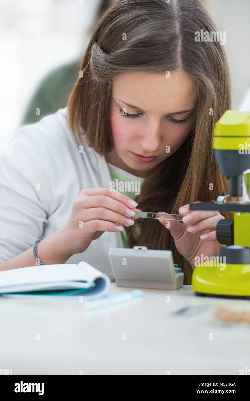Plant science girl microscope hires stock photography and images Alamy