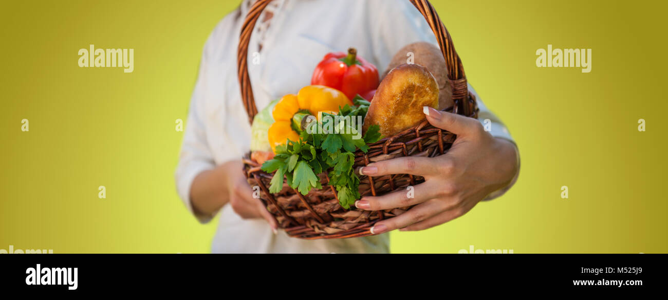 Vegetables in hands. Unrecognizable woman holding basket full of ...