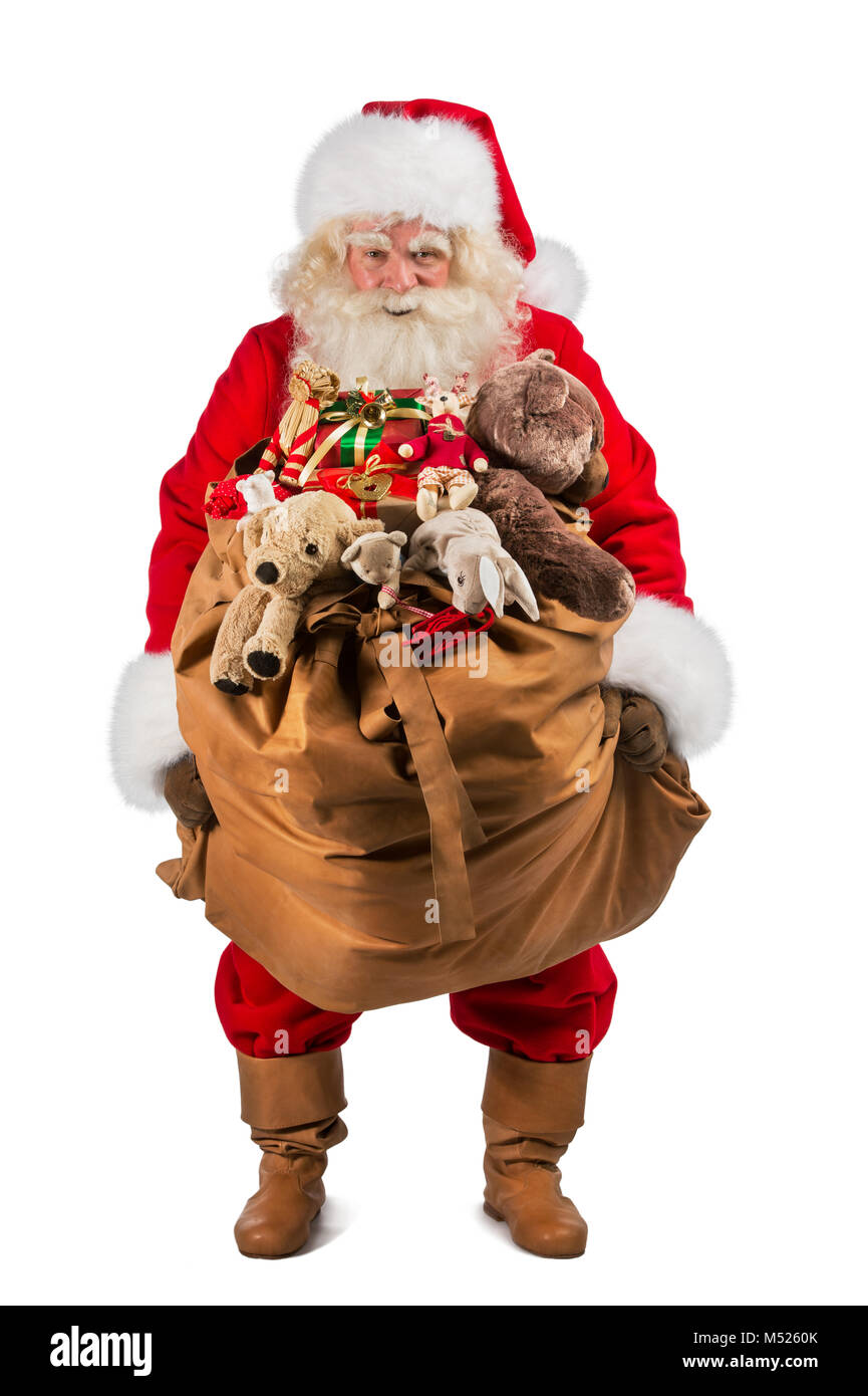Full length of Real Santa Claus carrying big bag full of gifts ...