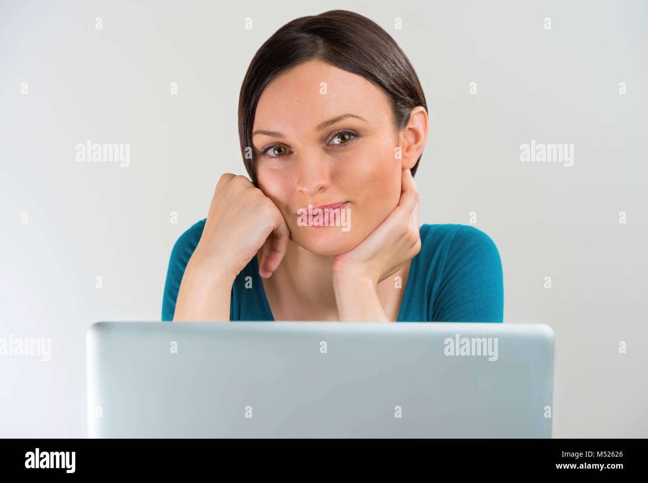 Portrait of a pretty young student girl smiling with a laptop Stock ...
