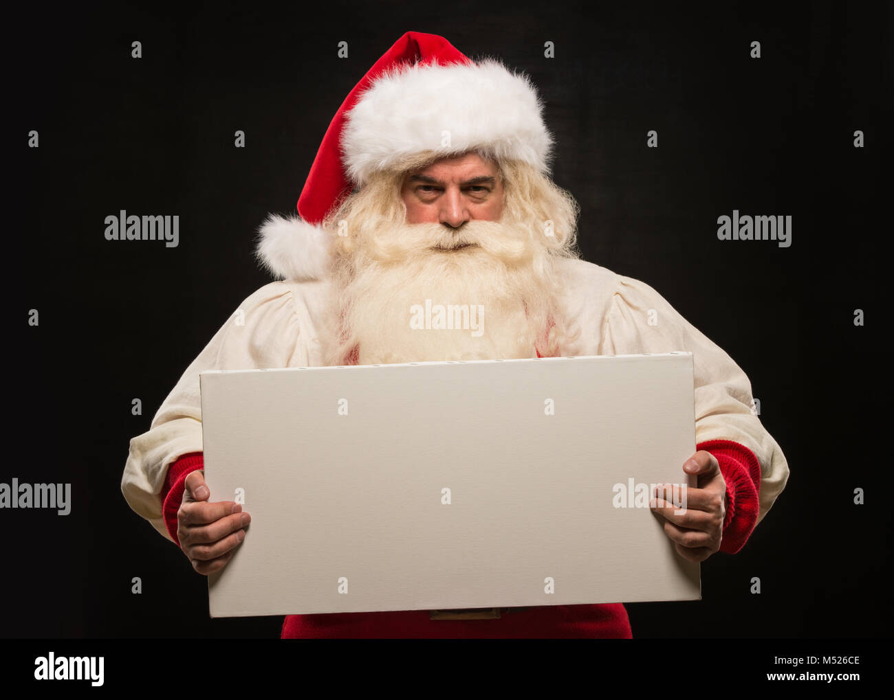 Santa Claus holding white blank sign with fun and smile standing ...