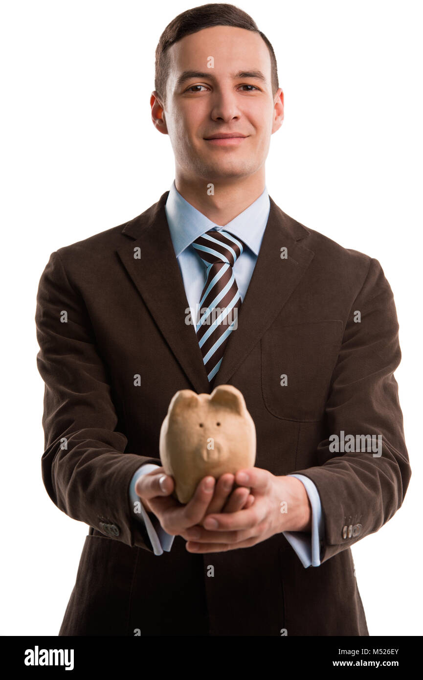 Young happy business man holding piggybank over white background Stock ...