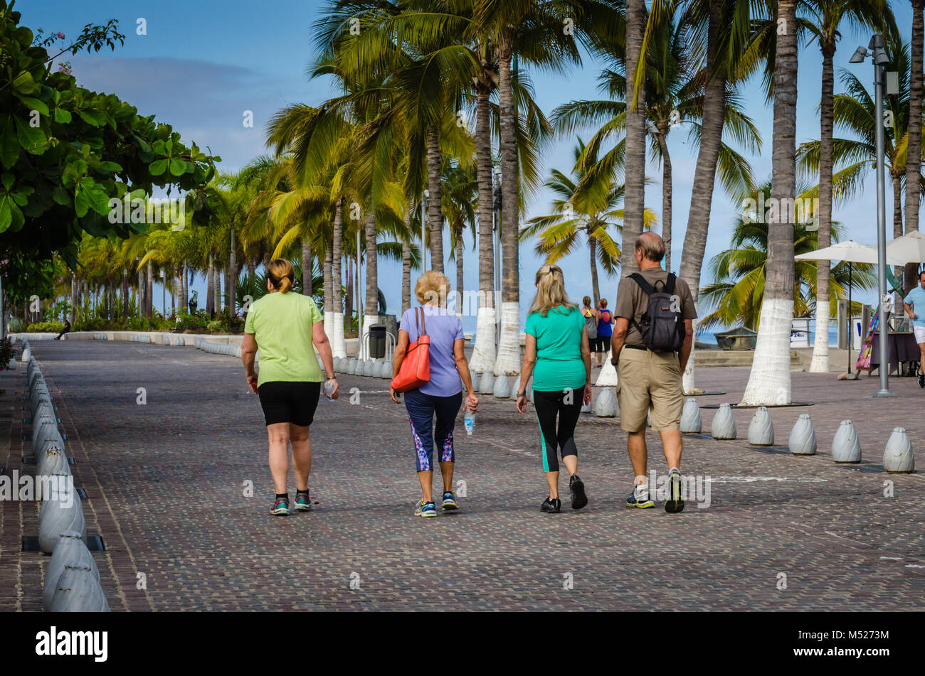 Tourist walking along the Malecón, a 12-block, mile-long walking path in Puerto Vallarta, Jalisco, Mexico. Stock Photo
