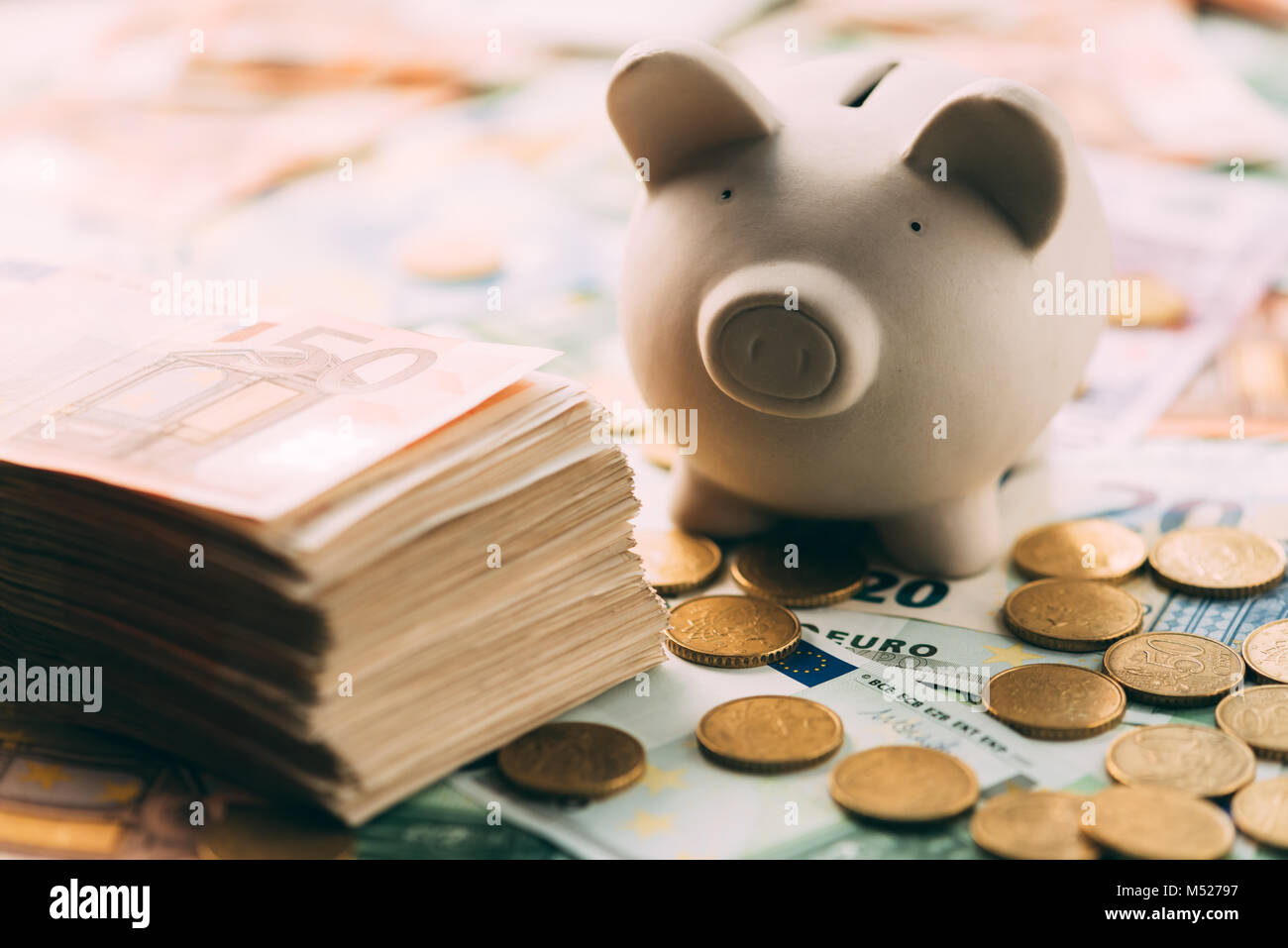 Piggy moneybox with euro cash Stock Photo