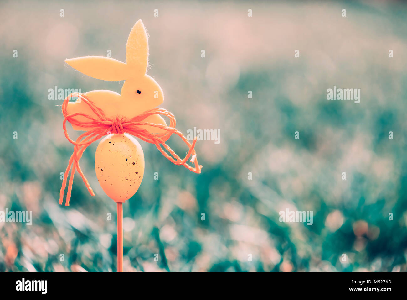 Easter background concept with yellow bunny figure Stock Photo