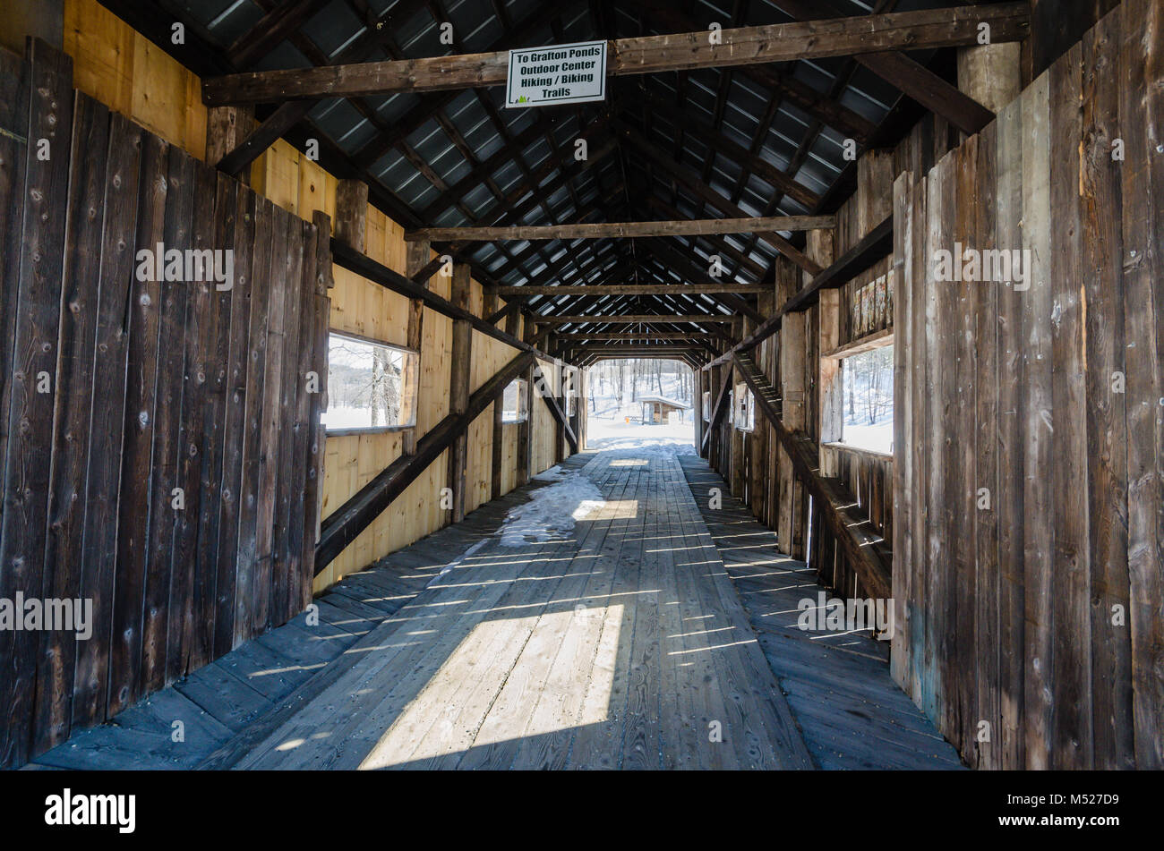The McWilliam Covered Bridge is a 62 foot wooden span crossing a branch of the Saxtons River in Grafton, Vermont. Stock Photo