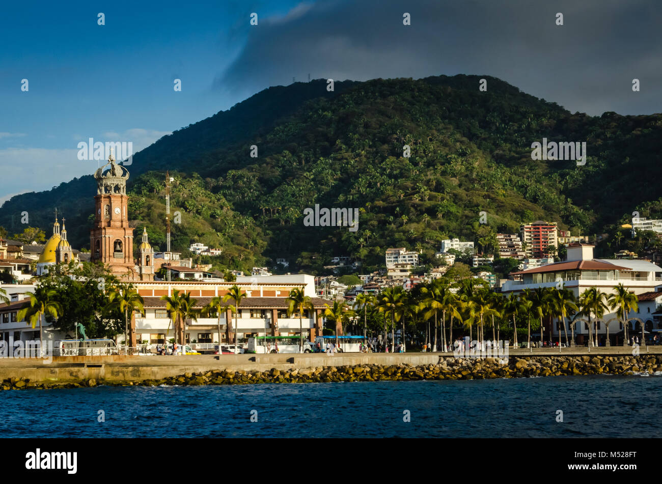 Shoreline view of Puerto Vallarta, Jalisca, Mexico includes Malecon, shops, and cathedral. Stock Photo