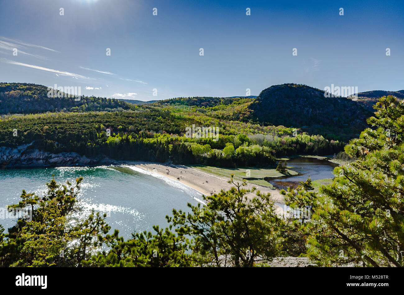 Set between granite mountains and rocky shores of Mount Desert Island, this beach is one of the most popular spots at Acadia National Park. Stock Photo