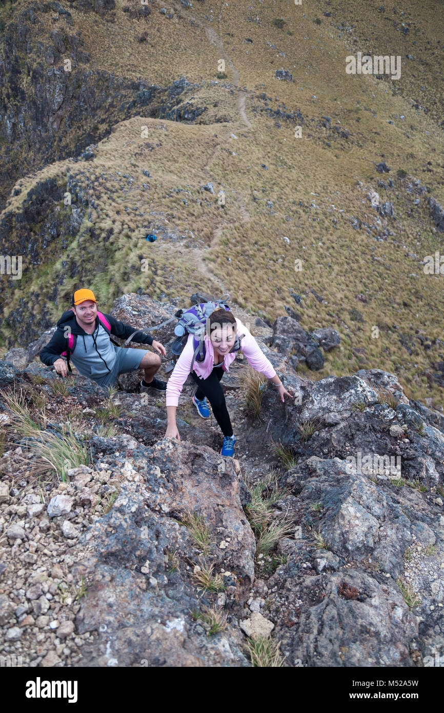 Hikers climbing a dangerous rocky section of Cerro Pelado in Guanacaste, Costa Rica Stock Photo