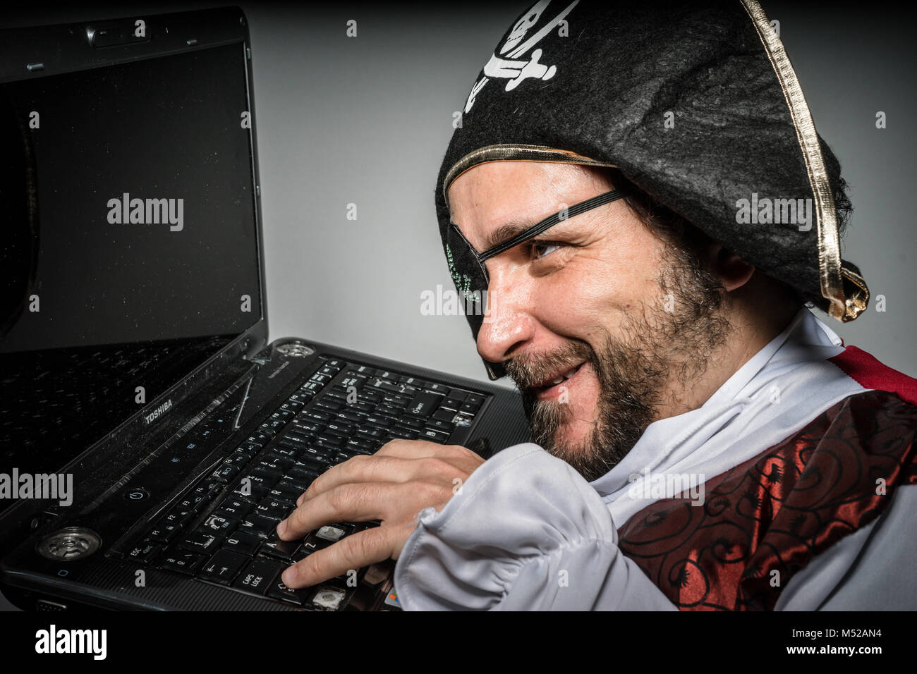 Stealing Hacker Cyber Criminal With Pirate Clothes Attempt To