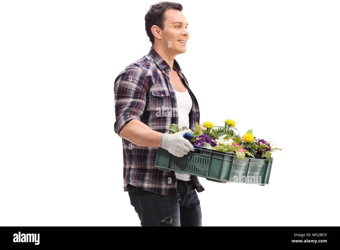 Gardener holding a rack of flowers isolated on white background Stock Photo