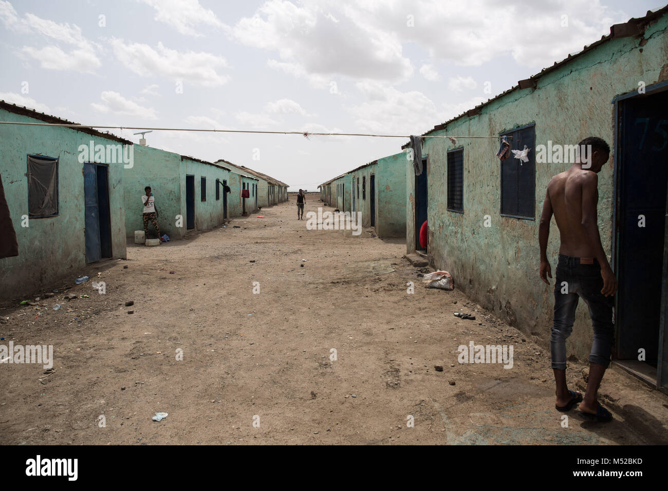 A man walks into his accommodation in the new arrivals section of Shagarab camp, in eastern Sudan. Tens of thousands of Eritrean refugees live in the area, after escaping oppression and mandatory military service in their home country. Stock Photo