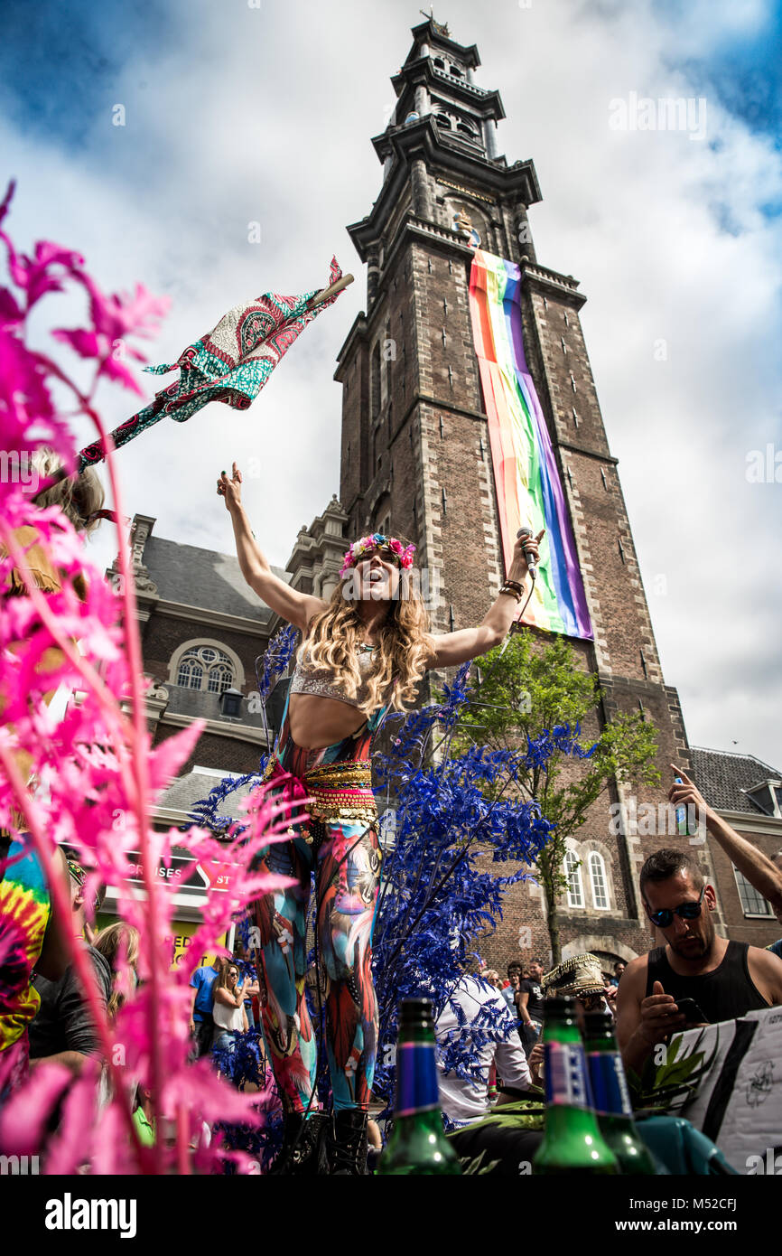 A female participant dance during the parade. Amsterdam Pride Parade 2017 hosted in the canals of the Dutch capital city. Stock Photo