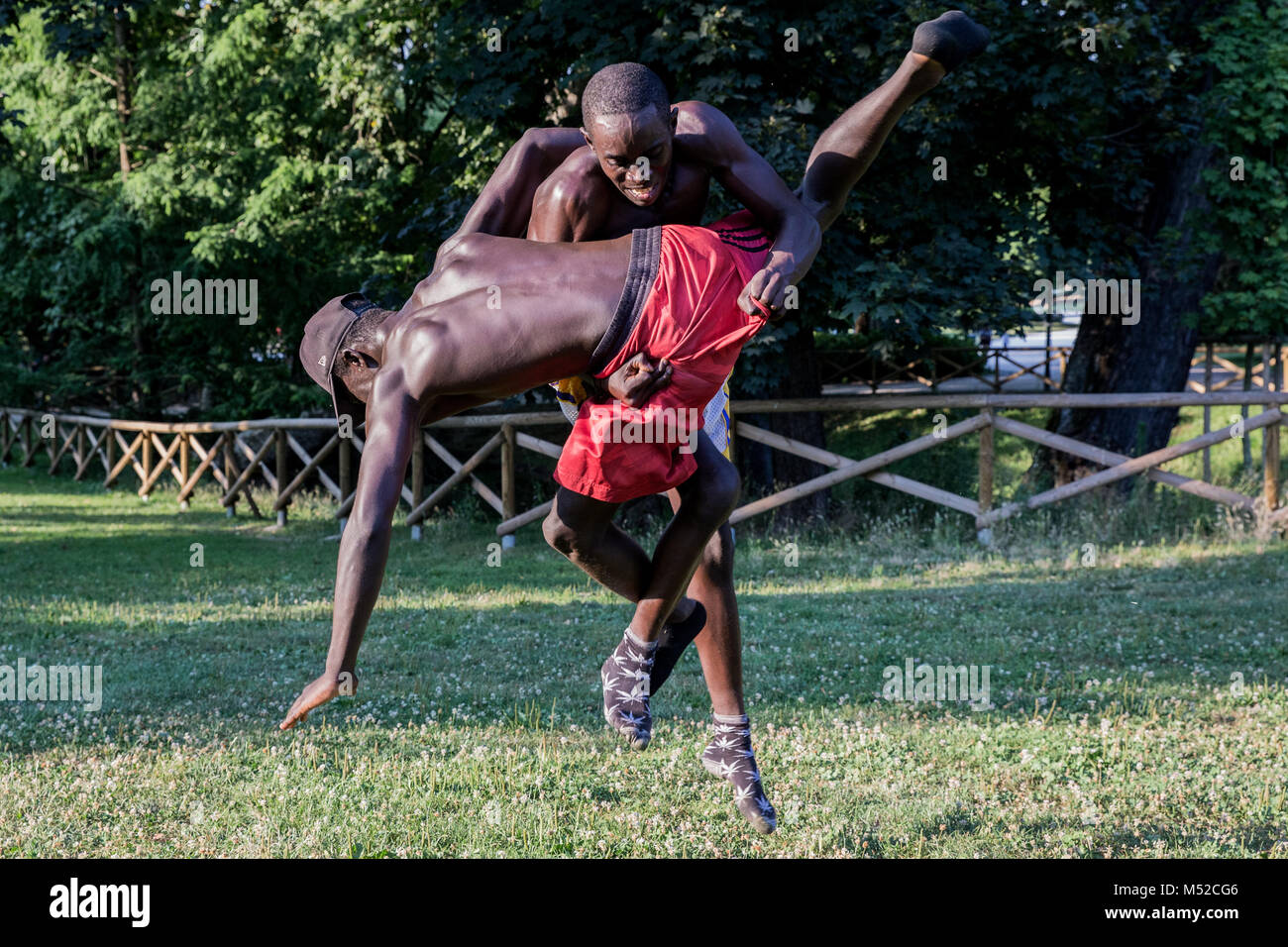 Young men seen at a Greco-Roman Wrestling training session in Milan's Sempione park Stock Photo
