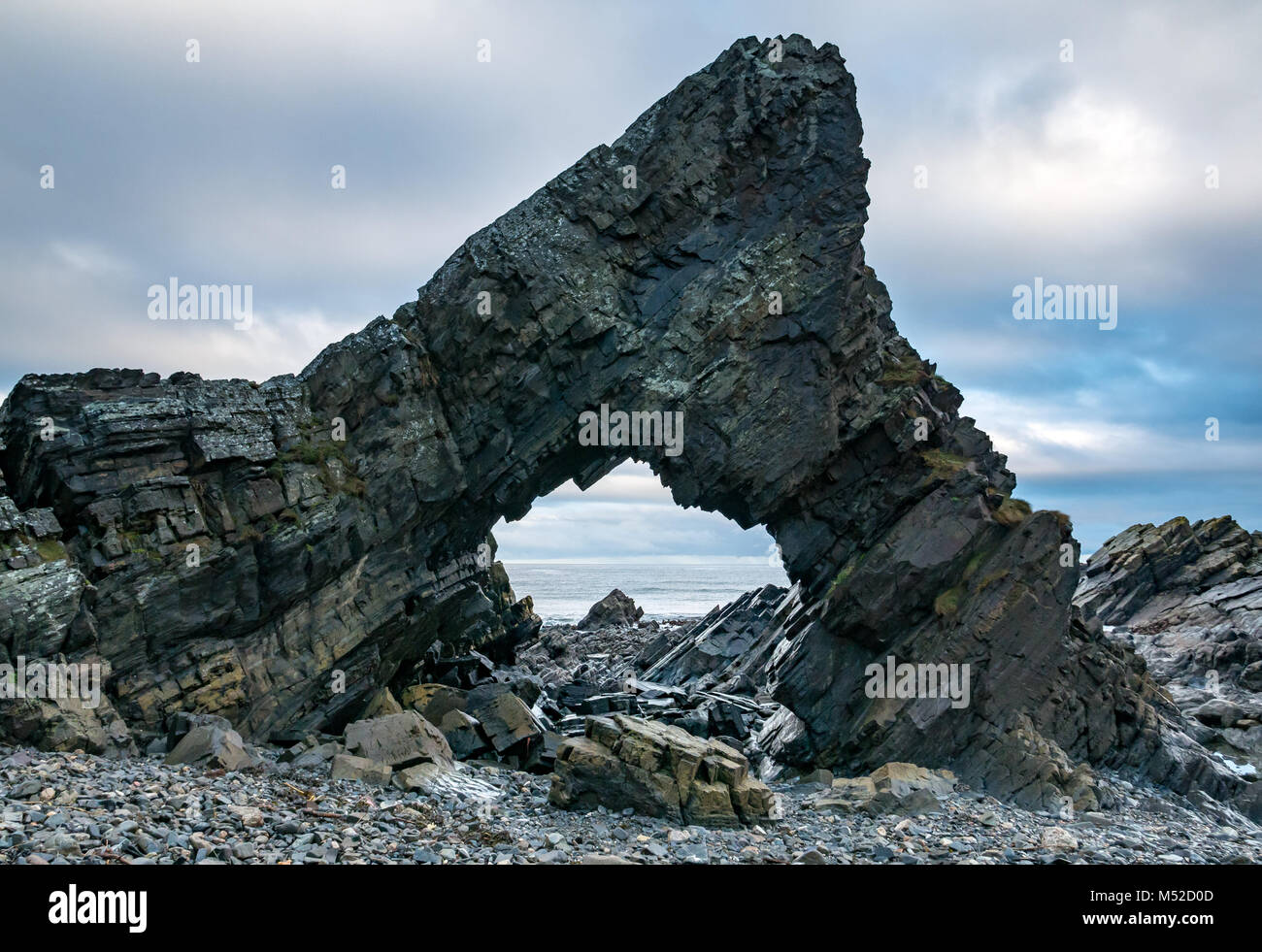Looking through hole, natural worn sea arch, Tarlair Rock, MacDuff, Aberdeenshire, Scotland, UK Stock Photo