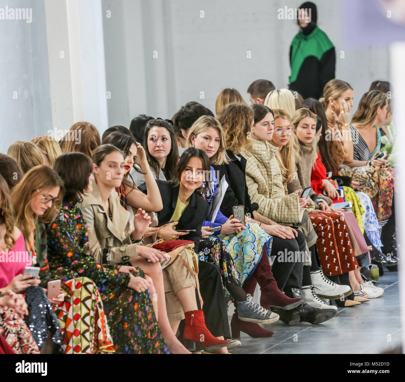 People seen watching the show in front of the runway at the Preen by ...