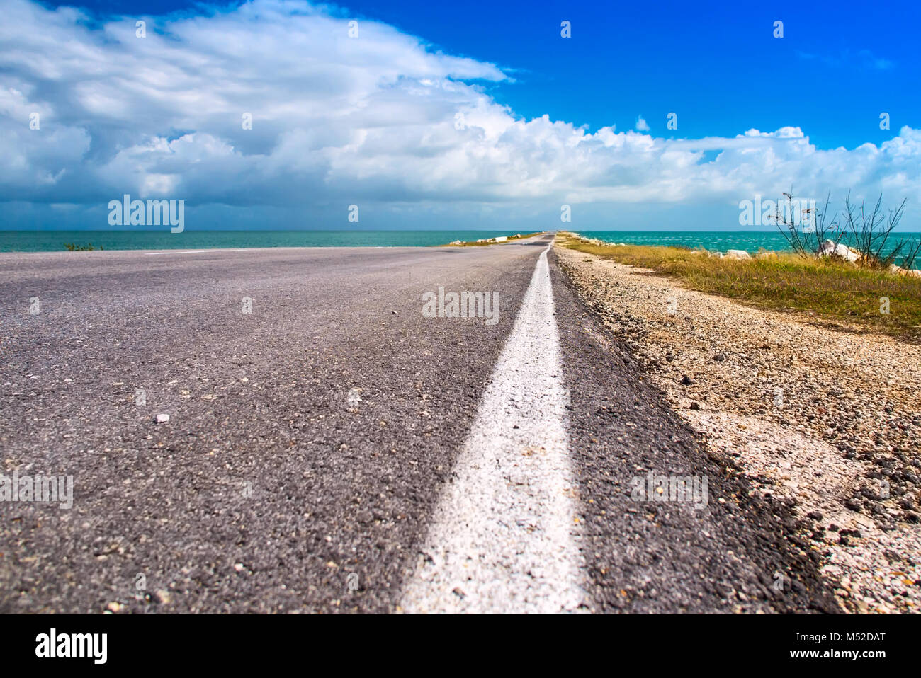 Road highway route leaving in ocean bulk man-made artificial dam from island of Cuba to Cayo Guillermo Atlantic Ocean Latin America Stock Photo