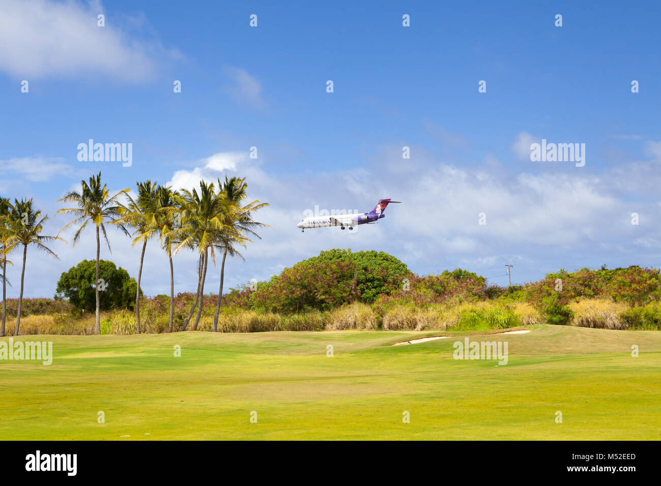 a plane landing in hawaii kawaii with sun Stock Photo