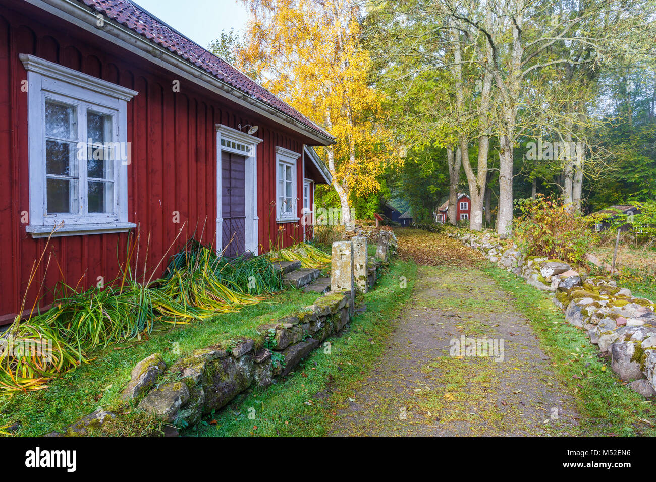 Rural country house at a road on the countryside Stock Photo - Alamy