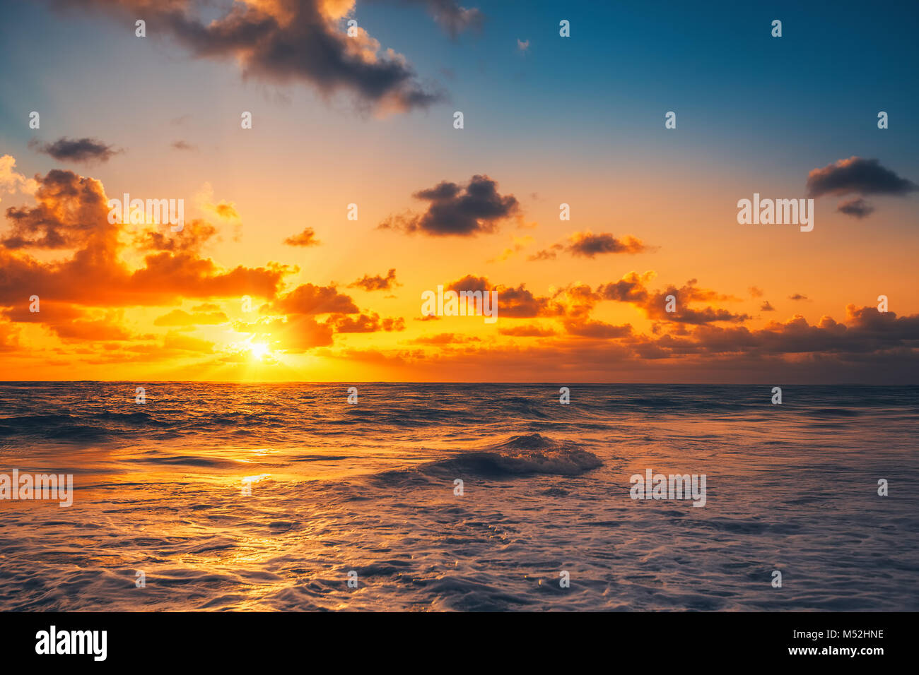 Beautiful cloudscape over the sea, sunrise shot Stock Photo - Alamy
