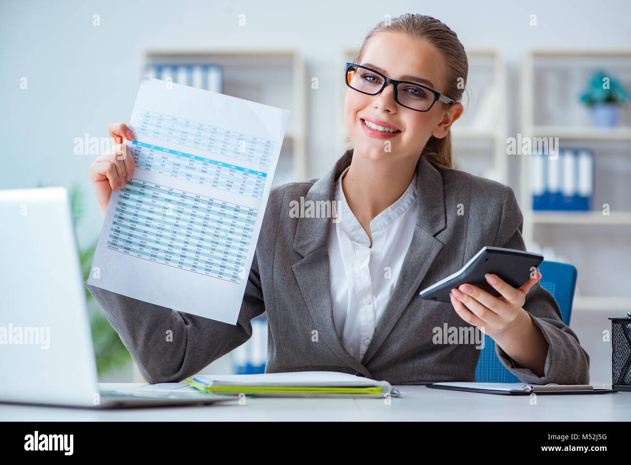Young businesswoman accountant working in the office Stock Photo - Alamy