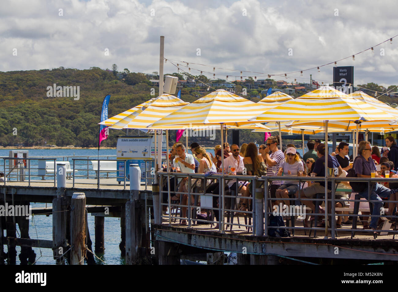 Sydney, Australia: People having a break sitting in a bar, drinking and talking Stock Photo