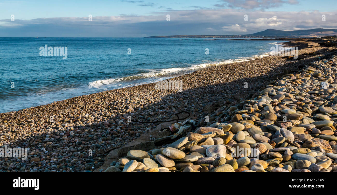Long pebble beach, Spey Bay, Moray, Scotland, UK, largest shingle beach in Scotland Stock Photo