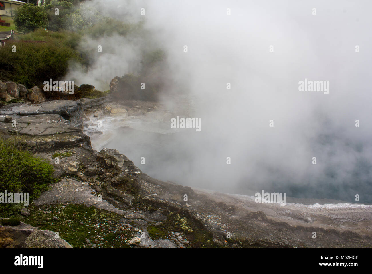 Geothermal Hot Springs with steam rising Stock Photo