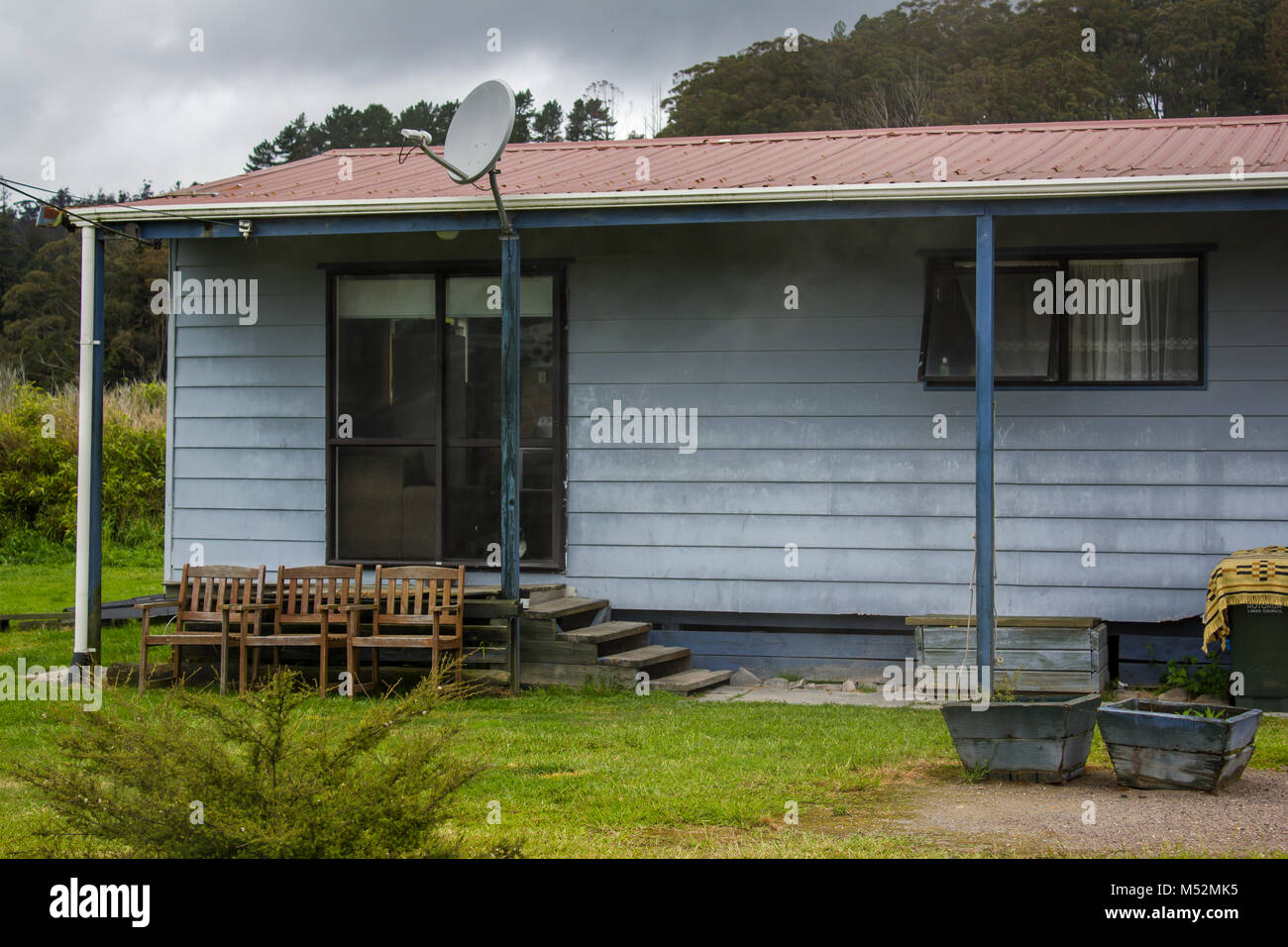 Prefabricated house with chairs outside Stock Photo