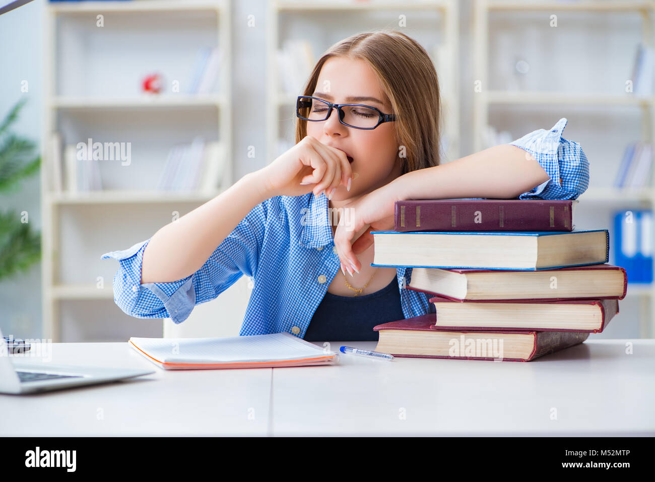 Young teenage female student preparing for exams at home Stock Photo ...