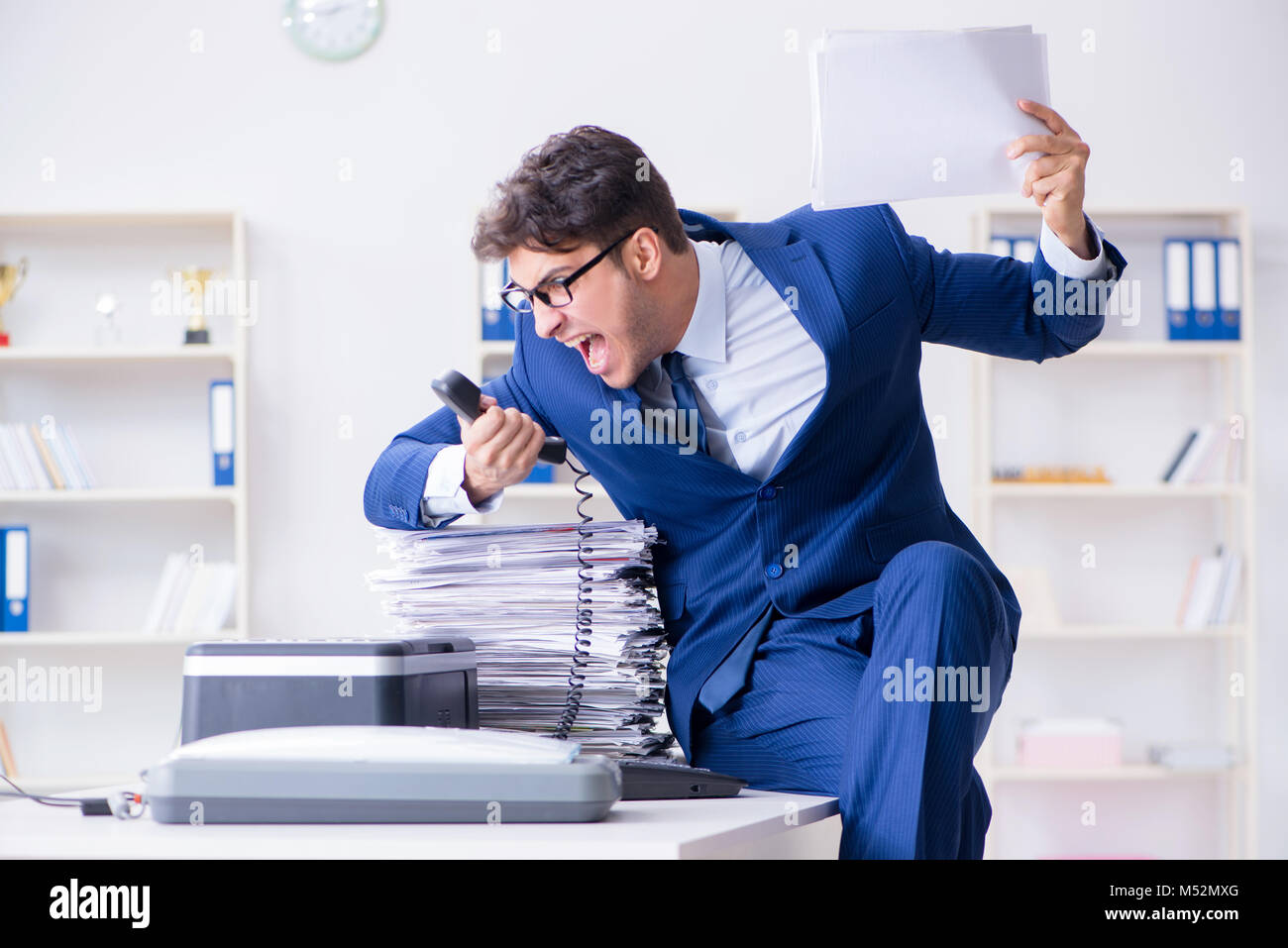 Businessman making copies in copying machine Stock Photo - Alamy