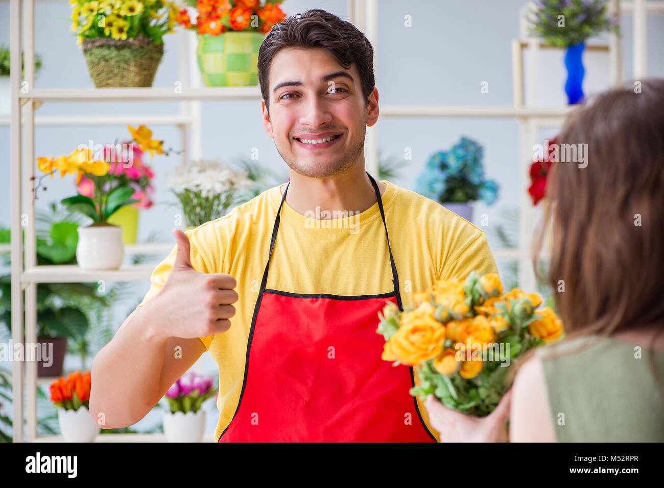 Florist selling flowers in a flower shop Stock Photo Alamy