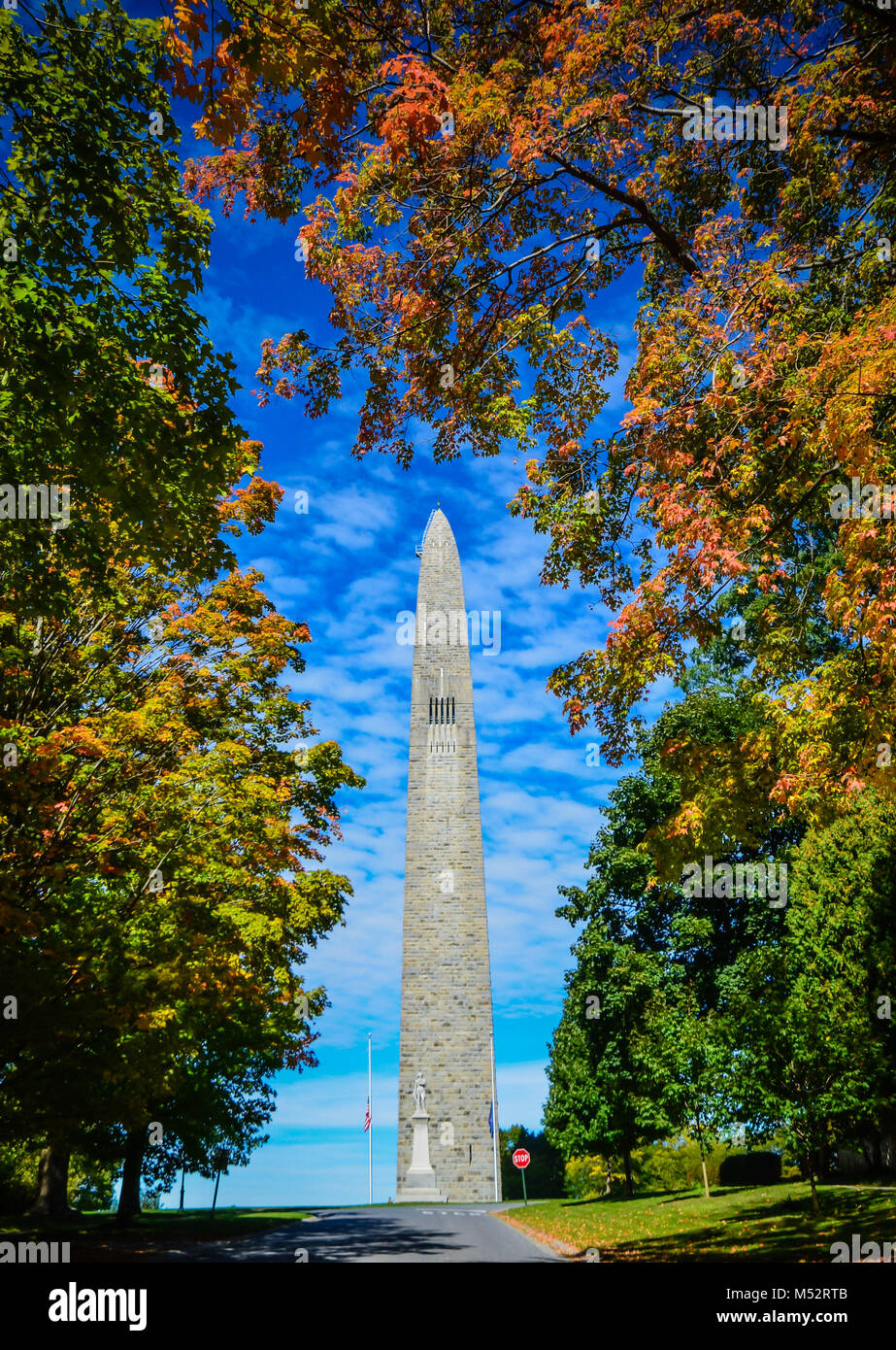 Bennington Battle Monument framed by colorful fall foliage in Bennington, VT, USA. Stock Photo