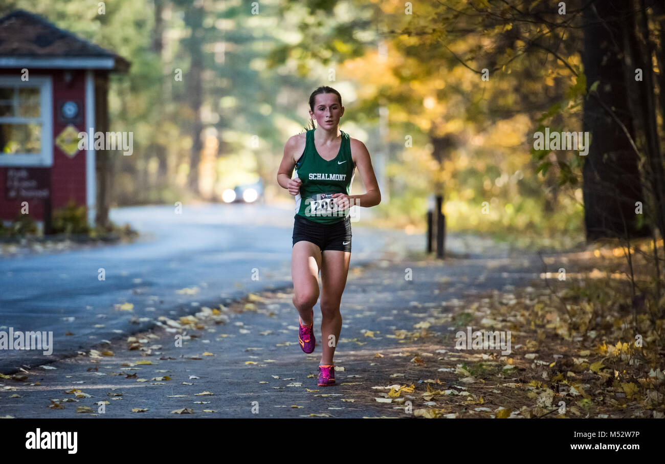 Teenage girl leads at Cross Country race in Saratoga Springs, New York. Stock Photo