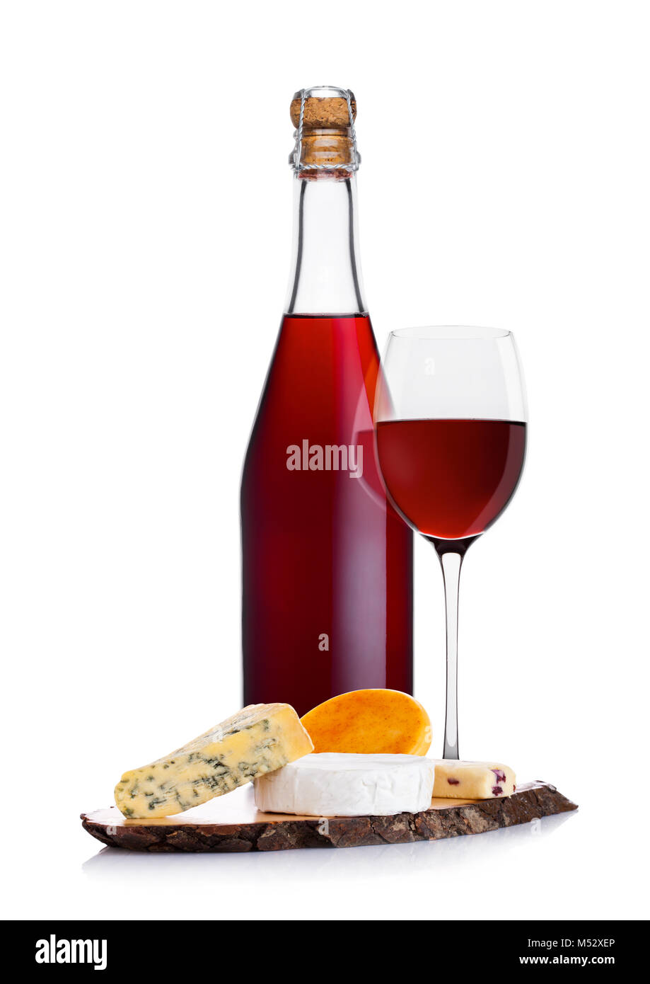 Bottle of homemade red wine with cheese selection and glass on white background Stock Photo