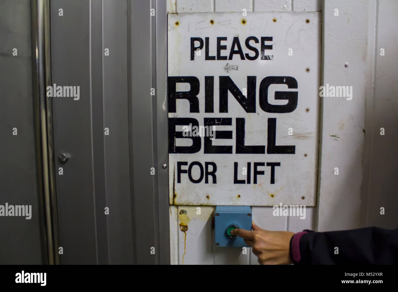 Underground Elevator, hand ringing bell for lift Stock Photo