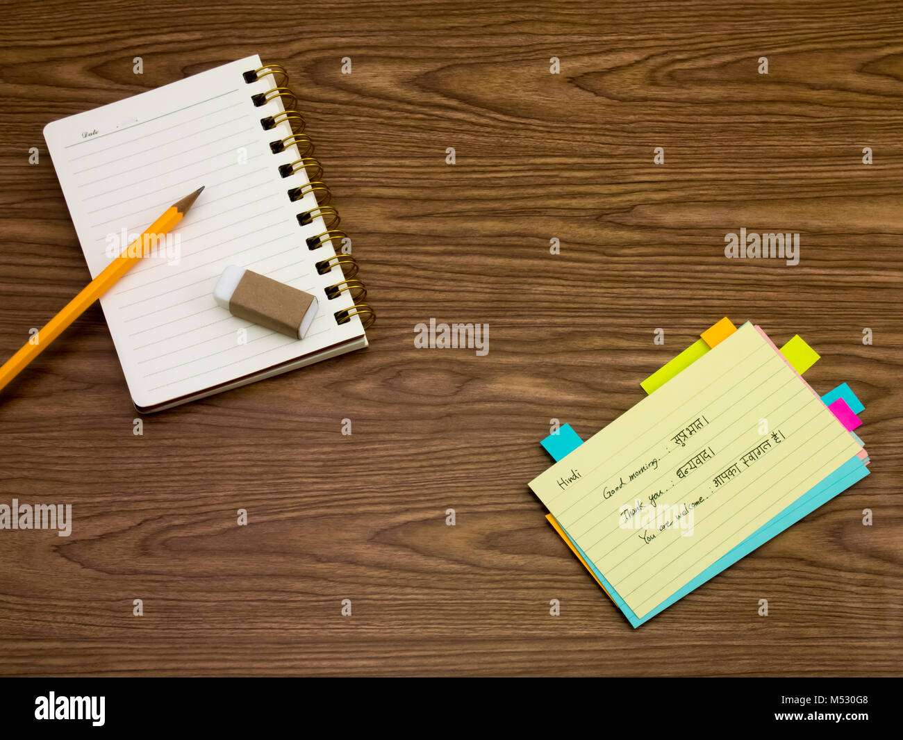 Hindi; Learning New Language Writing Words on the Notebook Stock Photo