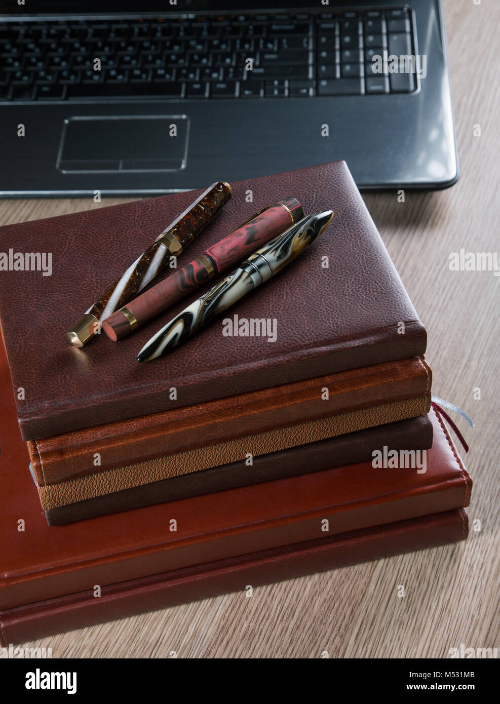 fountain pens and diaries with leather cover Stock Photo