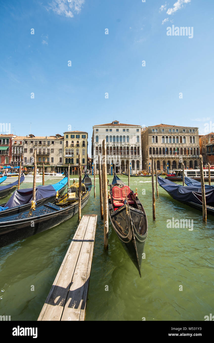 The Grande canal in the beautiful gorgeous city of Venice in Italy, venisia, Europe, gondolas sitting in the water covered with tarpaulin Stock Photo